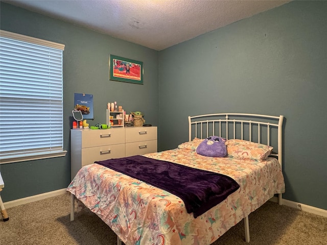 18310 Grayson Bluff Way, Richmond, TX 77407 - carpeted bedroom featuring baseboards and a textured ceiling
