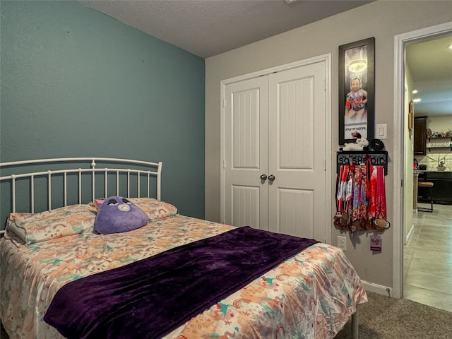 carpeted bedroom featuring a closet