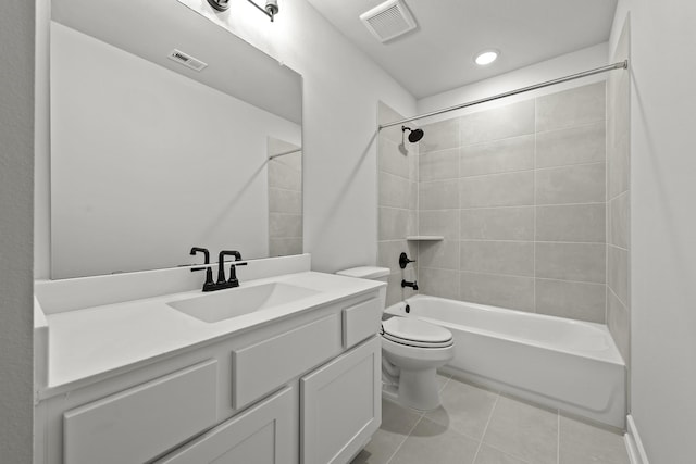 bathroom with visible vents, tile patterned floors, toilet, and vanity