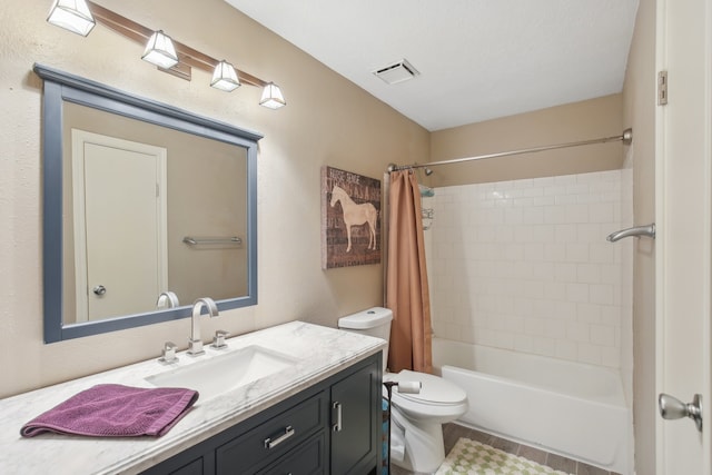 full bathroom with vanity, toilet, and shower / tub combo