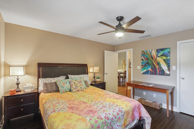 bedroom with ceiling fan and dark hardwood / wood-style floors