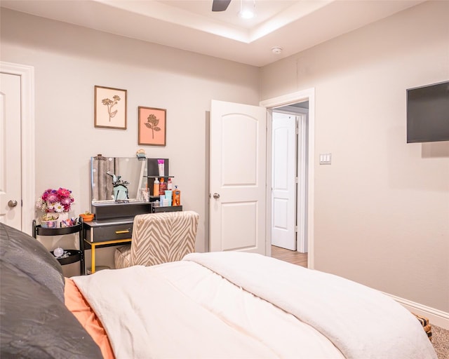 2523 Turberry Dr, West Columbia, TX 77486 - bedroom with fridge, ceiling fan, a tray ceiling, and baseboards