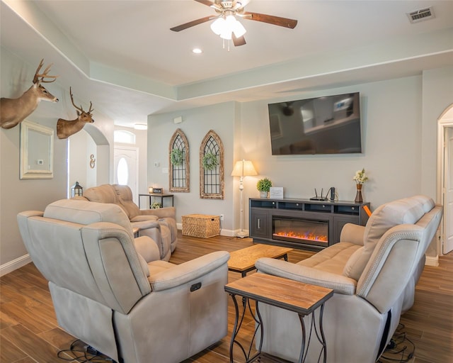 2523 Turberry Dr, West Columbia, TX 77486 - living room featuring arched walkways, baseboards, ceiling fan, a glass covered fireplace, and recessed lighting