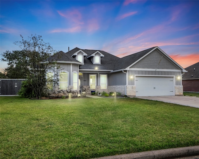 craftsman-style house with a lawn and a garage