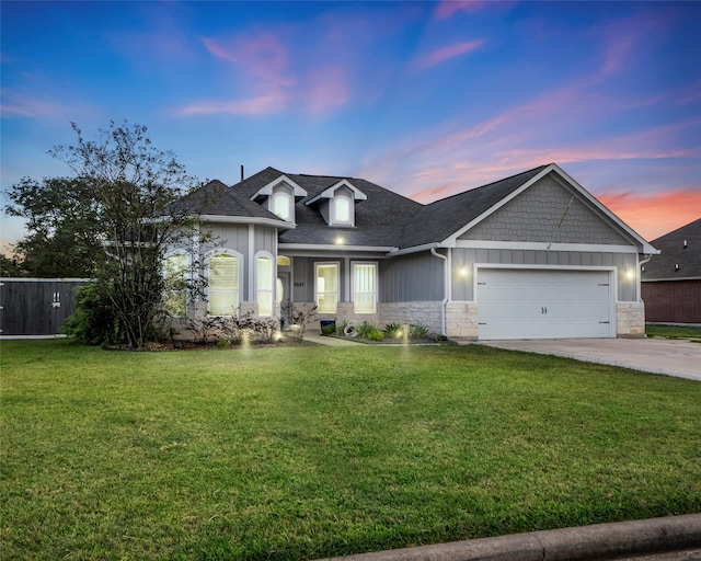 2523 Turberry Dr, West Columbia, TX 77486 - view of front facade featuring stone siding, an attached garage, concrete driveway, and a yard