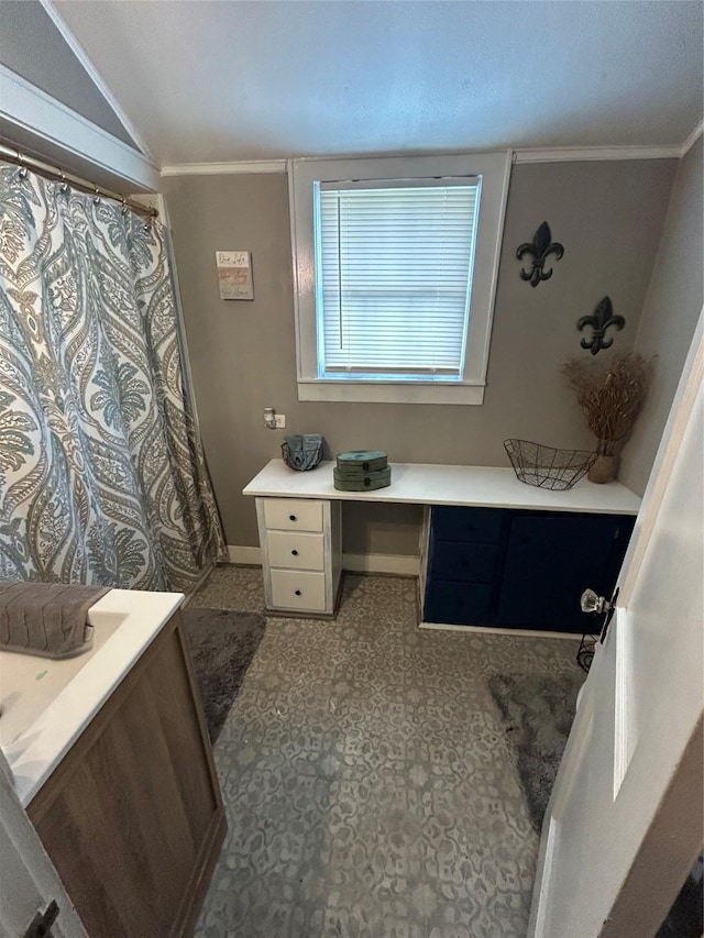 full bathroom with crown molding, baseboards, vaulted ceiling, and a shower with shower curtain
