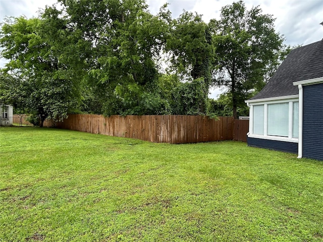 view of yard with a fenced backyard