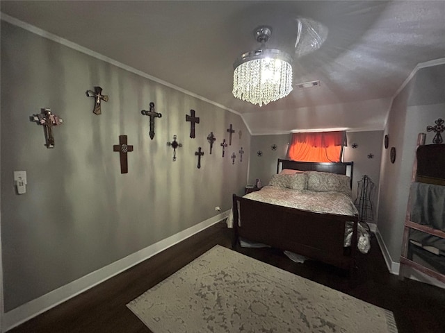 bedroom featuring baseboards, visible vents, dark wood-style floors, and a notable chandelier