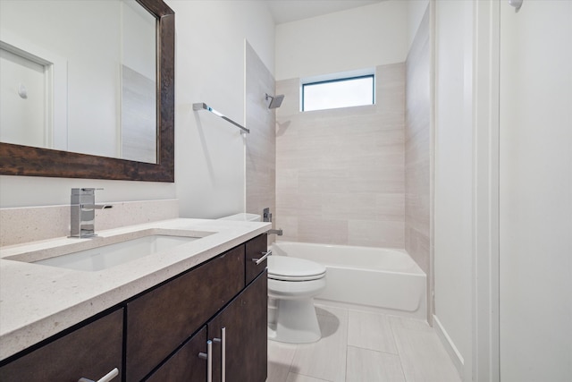 full bathroom featuring tile patterned flooring, tiled shower / bath combo, toilet, and vanity