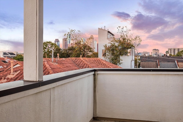 view of balcony at dusk