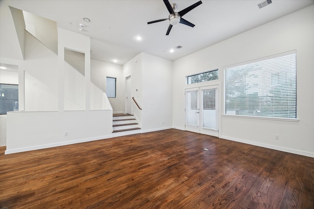 unfurnished living room featuring ceiling fan, french doors, and dark hardwood / wood-style floors