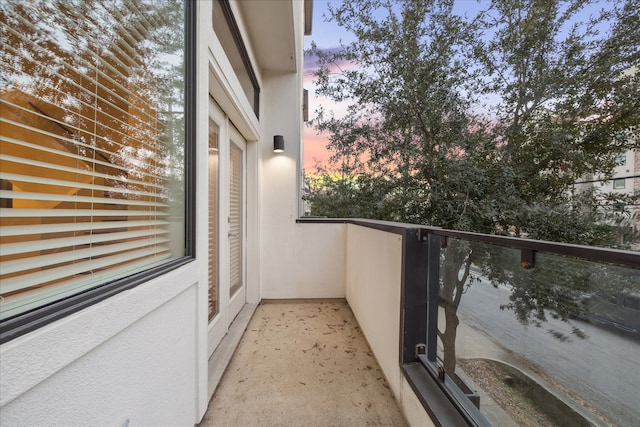 view of balcony at dusk