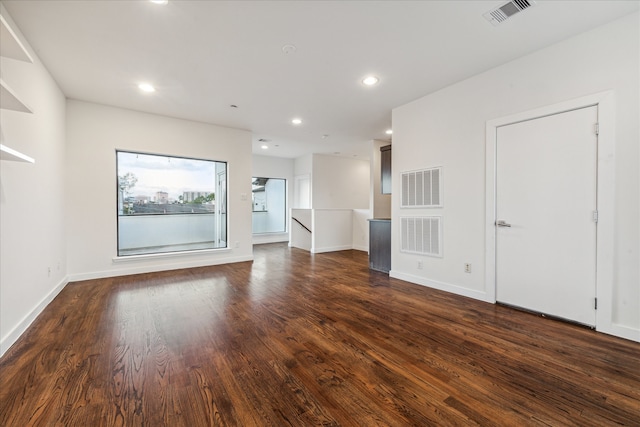 spare room with dark hardwood / wood-style floors