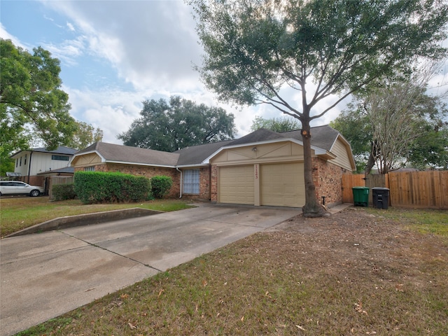 ranch-style home with a front lawn and a garage