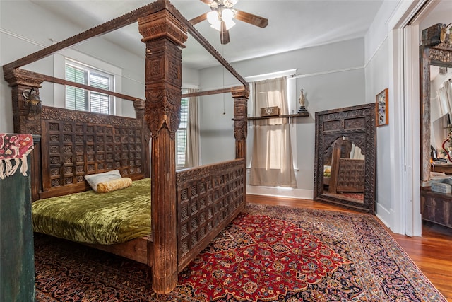 bedroom featuring hardwood / wood-style flooring and ceiling fan