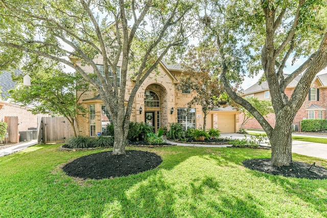 view of front of house featuring a front lawn and a garage