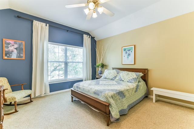 bedroom with ceiling fan, carpet, and vaulted ceiling