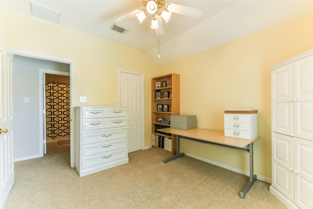 home office with light carpet, vaulted ceiling, and ceiling fan