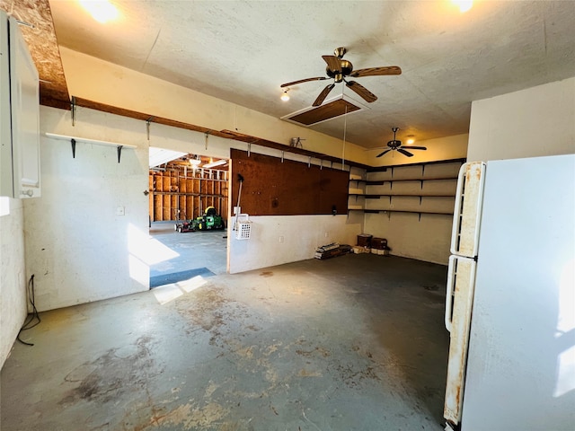 interior space featuring ceiling fan and white refrigerator