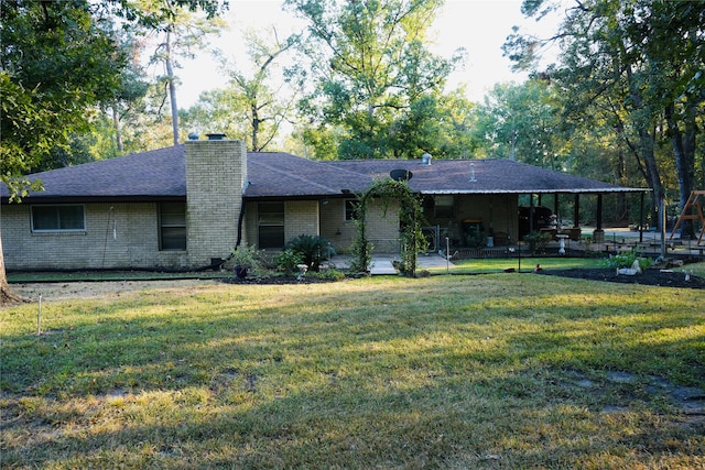 single story home featuring a front yard