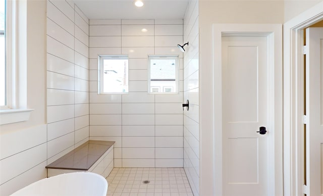 bathroom with a tile shower