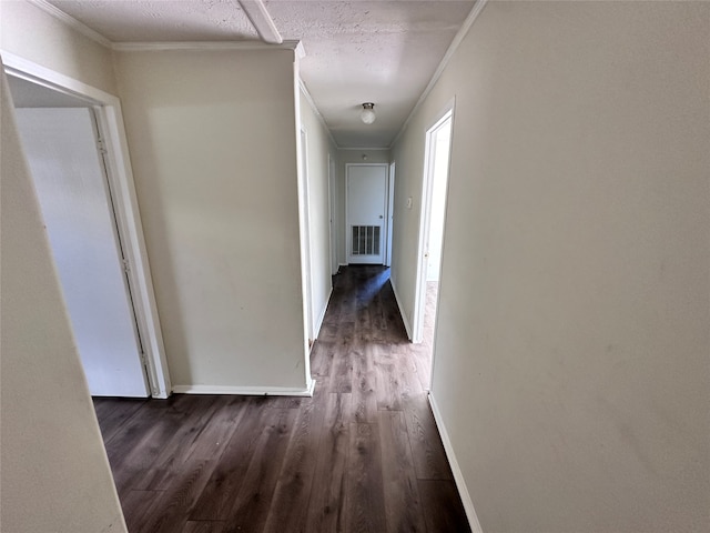 hall featuring ornamental molding and dark wood-type flooring