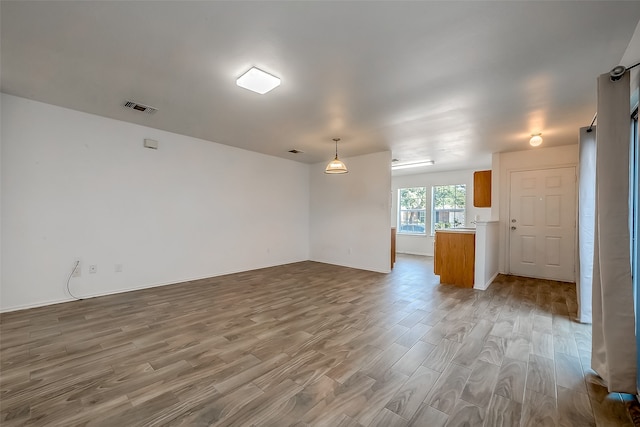 unfurnished room featuring light hardwood / wood-style floors