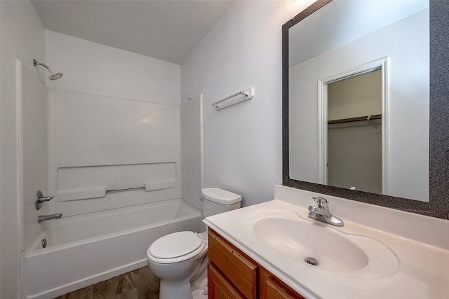 full bathroom featuring vanity, hardwood / wood-style floors, toilet, and shower / bath combination