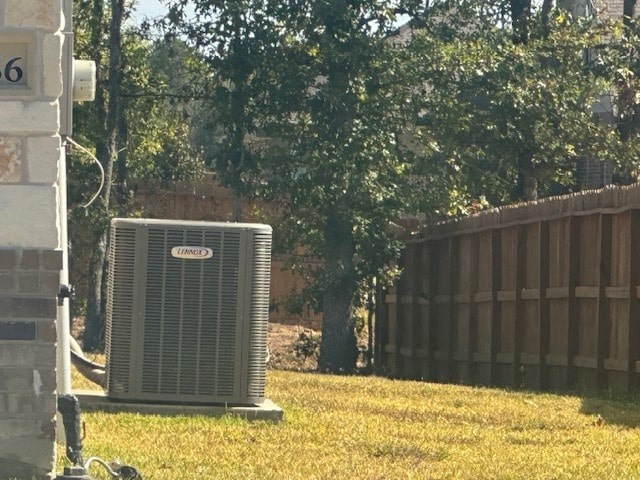 view of yard with central air condition unit