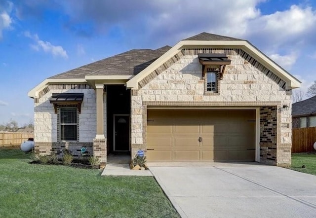 view of front facade with a front yard and a garage