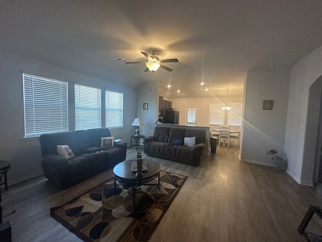 living room with dark hardwood / wood-style floors and ceiling fan