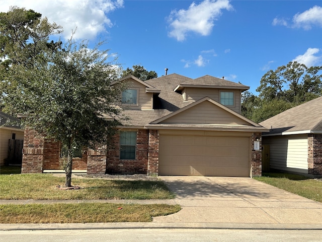 view of front of home featuring a front yard and a garage