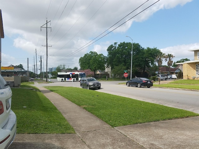 2601 Wheeler St, Houston, TX 77004 - view of asphalt road featuring street lights, sidewalks, and traffic signs