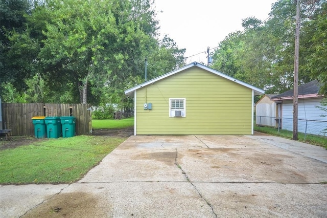 view of side of home featuring a patio area, a lawn, and cooling unit