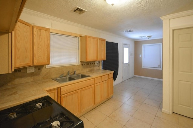 kitchen featuring black range with electric cooktop, tasteful backsplash, light brown cabinetry, sink, and ornamental molding