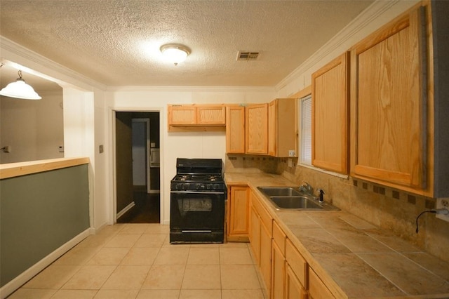 kitchen with black range with gas stovetop, hanging light fixtures, ornamental molding, sink, and tasteful backsplash