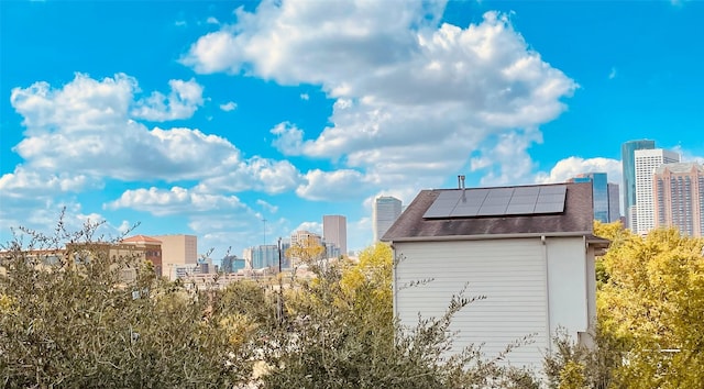 view of property exterior with solar panels