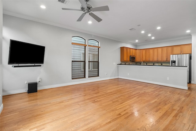 unfurnished living room featuring light hardwood / wood-style floors, ornamental molding, and ceiling fan