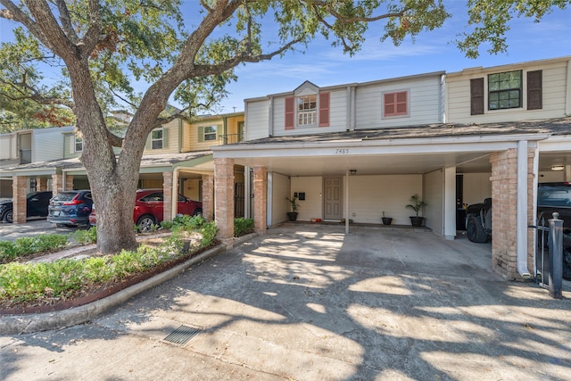 townhome / multi-family property with a carport