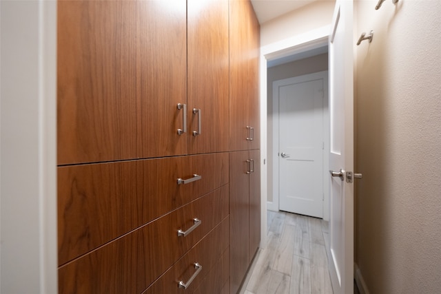 corridor featuring light hardwood / wood-style floors