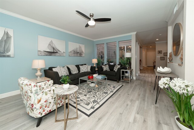 living room with crown molding, hardwood / wood-style flooring, and ceiling fan