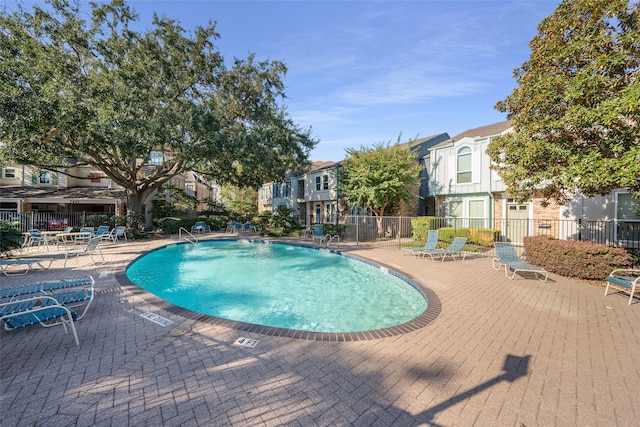 view of swimming pool featuring a patio area