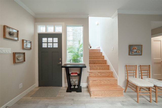 foyer featuring light hardwood / wood-style floors and ornamental molding