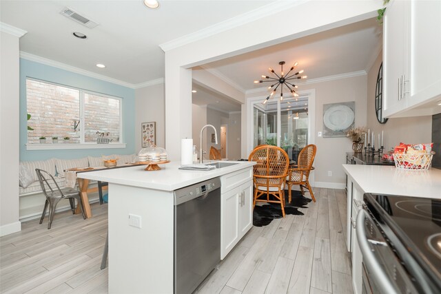 kitchen featuring light hardwood / wood-style flooring, sink, an inviting chandelier, stainless steel dishwasher, and white cabinets