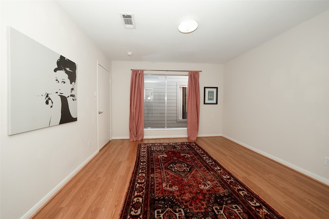 doorway to outside with hardwood / wood-style flooring