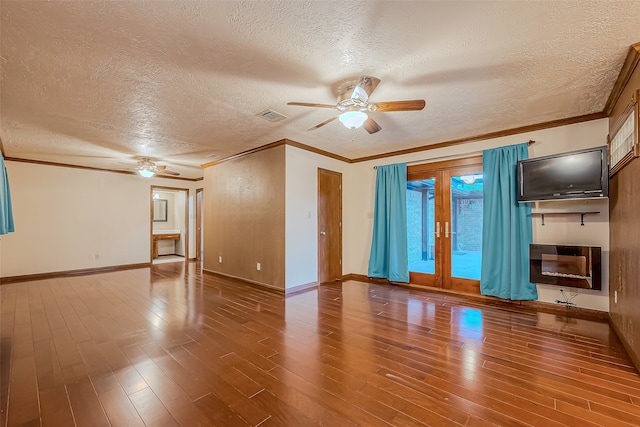 unfurnished room with a textured ceiling, hardwood / wood-style floors, and ceiling fan