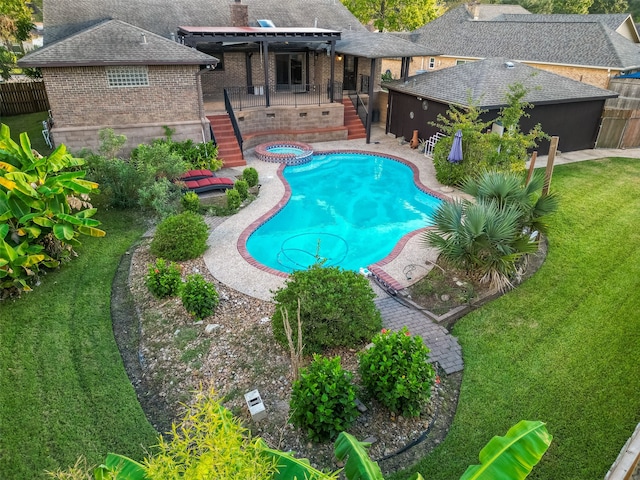 view of swimming pool featuring a patio and a lawn