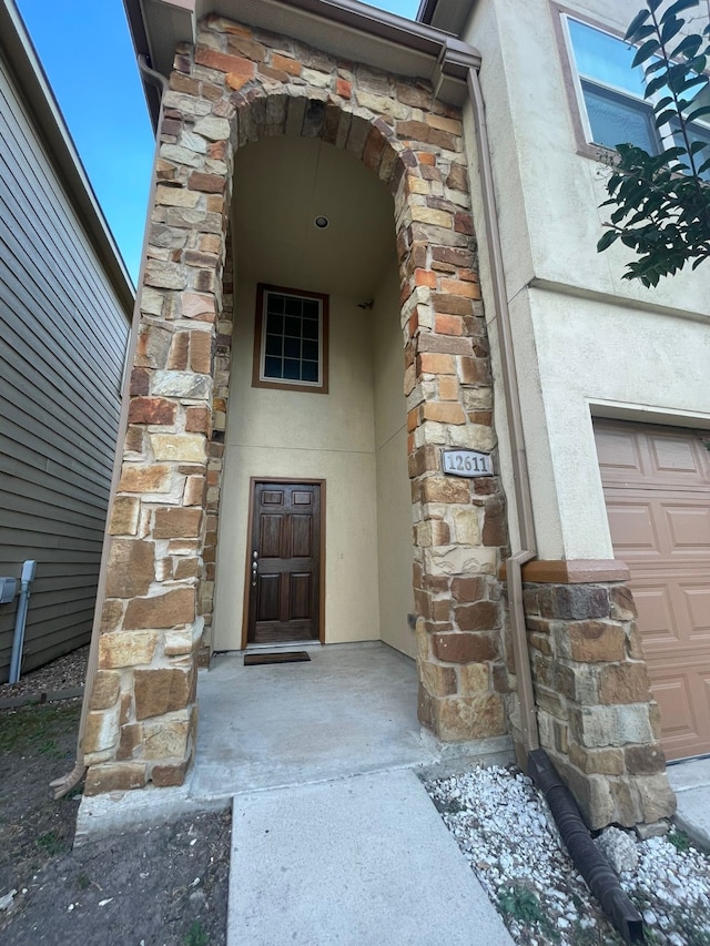 property entrance featuring a garage