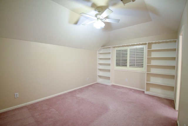 additional living space with light carpet, lofted ceiling, and ceiling fan