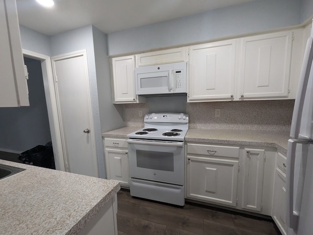 kitchen with white cabinets, white appliances, and tasteful backsplash